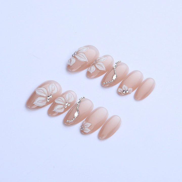 Artificial nail set with elegant flower designs and shimmering accents Bowlift