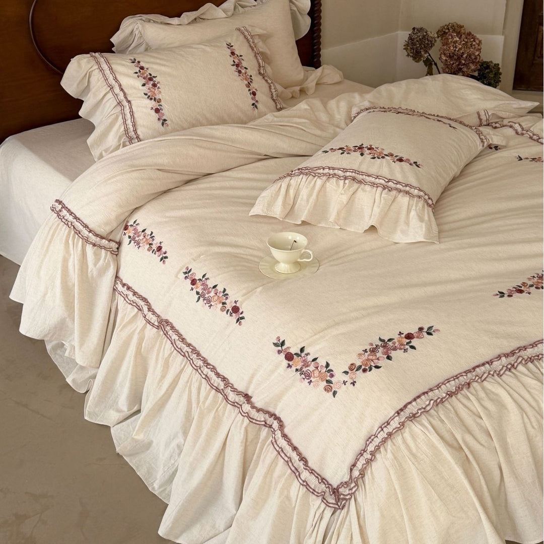 Romantic bedding set with ruffles and floral embroidery in linen look