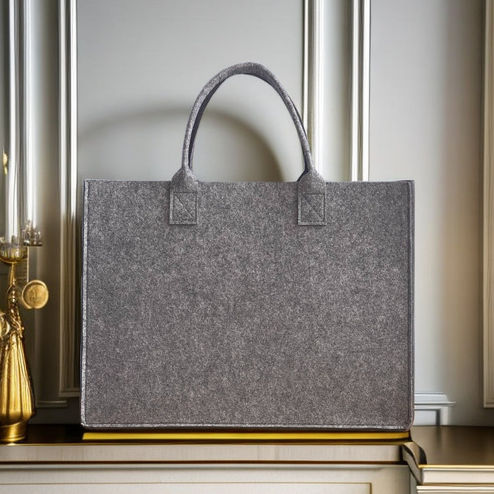 Structured felt tote bag with reinforced handles and organized interior Bowlift