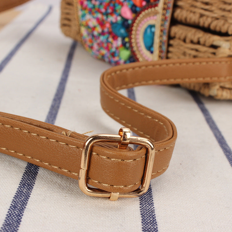 Fashionable straw shoulder bag with unique decor Bowlift