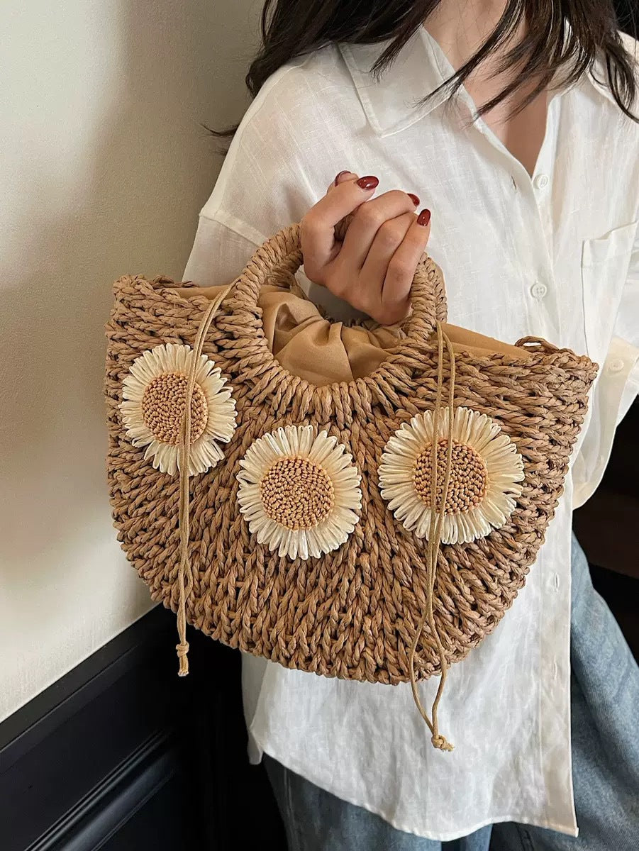 Handbag made of natural material with floral accents Bowlift