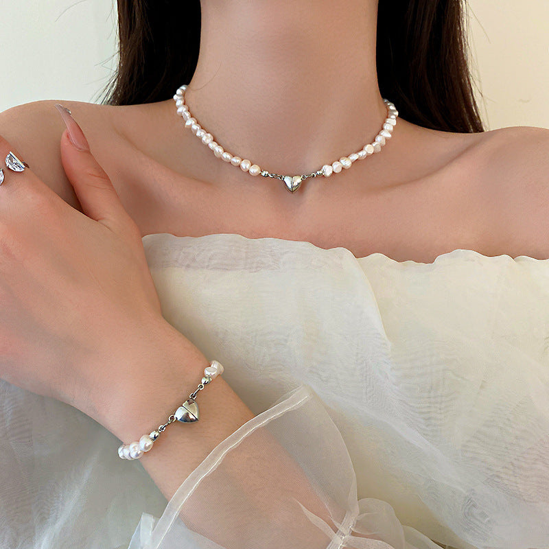 Elegant silver pearl bracelet with heart details Bowlift