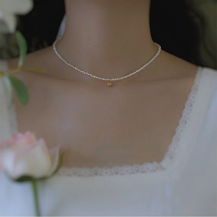 Delicate pearl necklace with elegant gold accent chain Bowlift