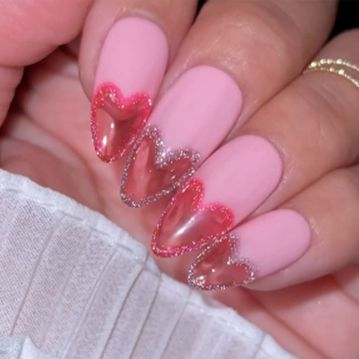 Artificial nails with romantic heart design and fine accents Bowlift