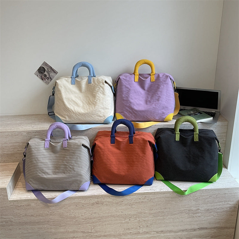 Fashionable Travel Bag with Ergonomic Carrying Strap and Structured Interior Bowlift