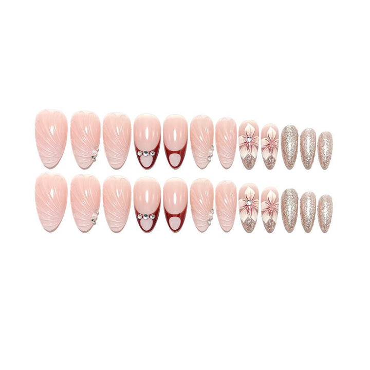 Artificial nails in elegant floral design with glitter accents Bowlift