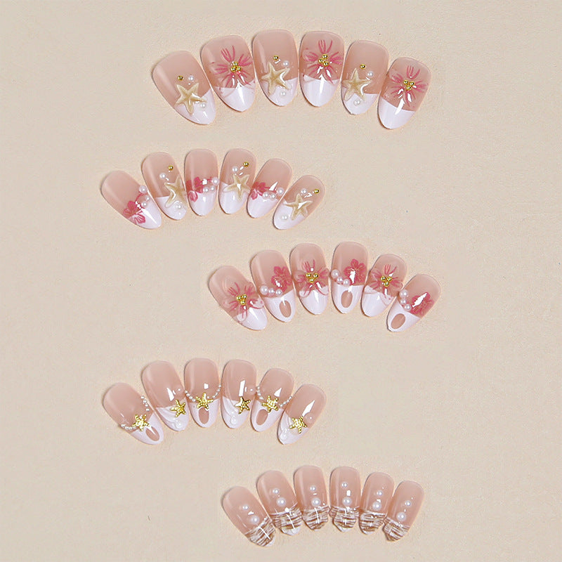 Elegant artificial nails with floral designs and glitter accents Bowlift