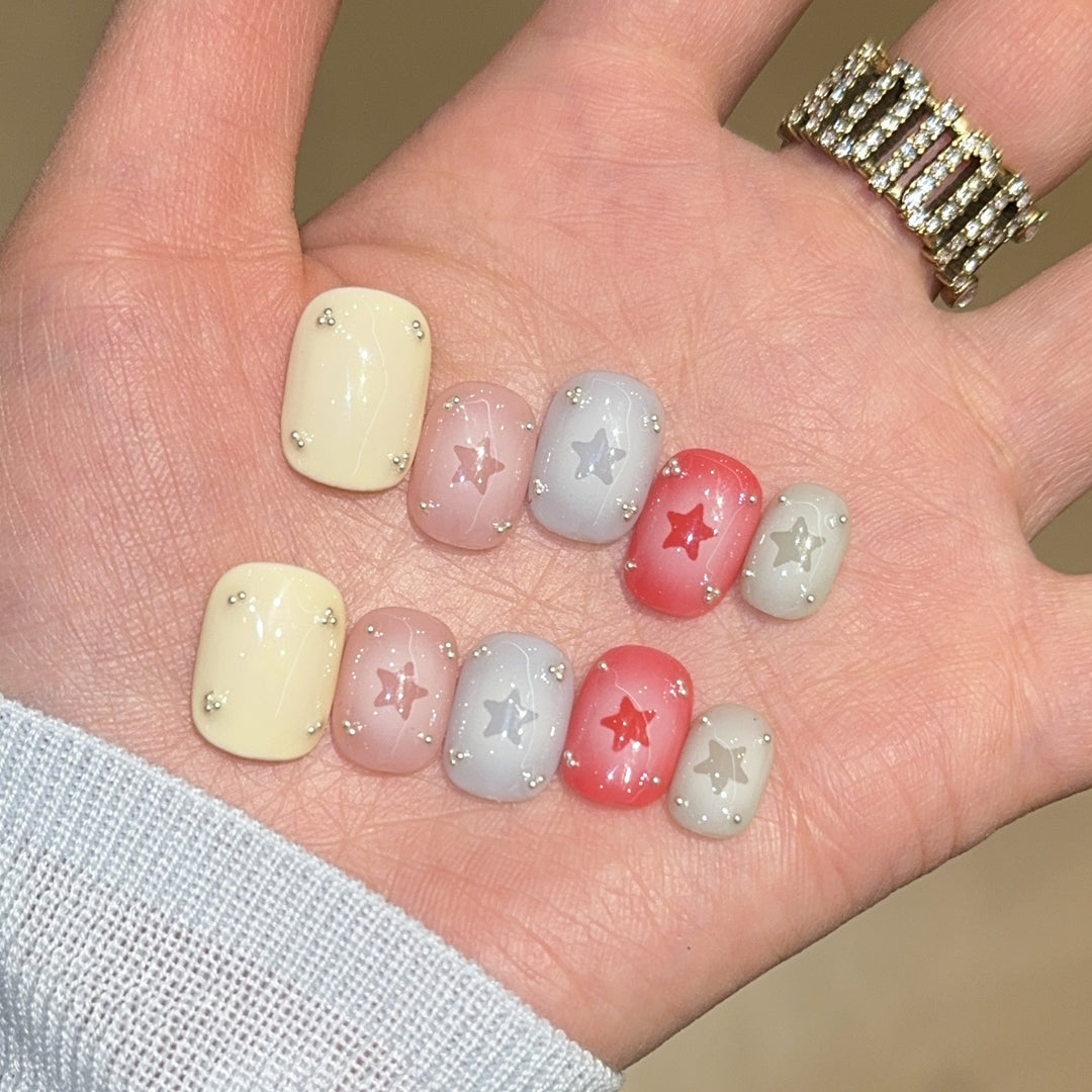 Artificial nails with sparkling star motifs Bowlift