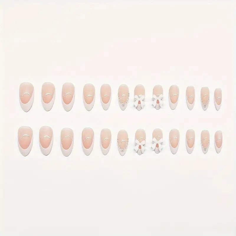 Artistic Press-On Nail Design with Bow Accents Bowlift