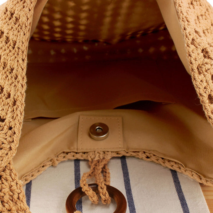 Handbag made of hand-knotted natural material with chic tassel decoration Bowlift