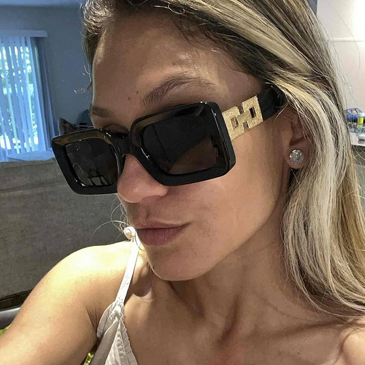 Women’s fashionable sunglasses in elegant square design with luxurious golden accents Bowlift
