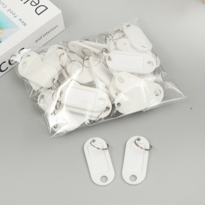 Unisex writable keychain with clear labeling field Bowlift