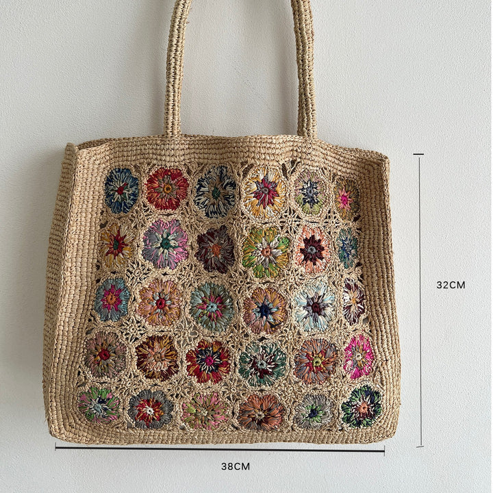 Braided shoulder bag with floral motif Bowlift