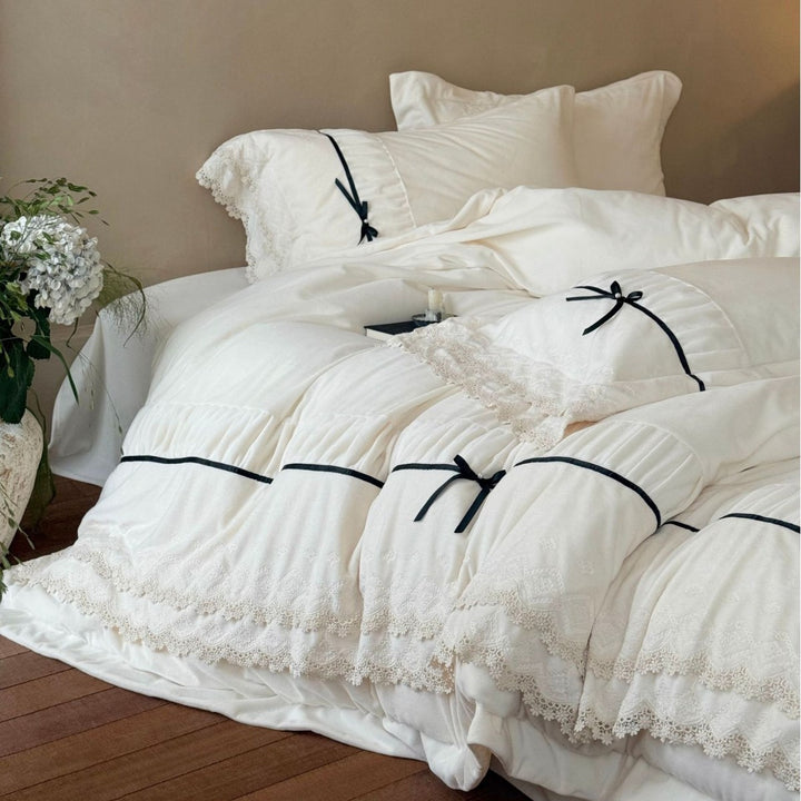 Romantic cotton satin bed linen set with ruffled hem, lace trim and decorative ribbons Bowlift