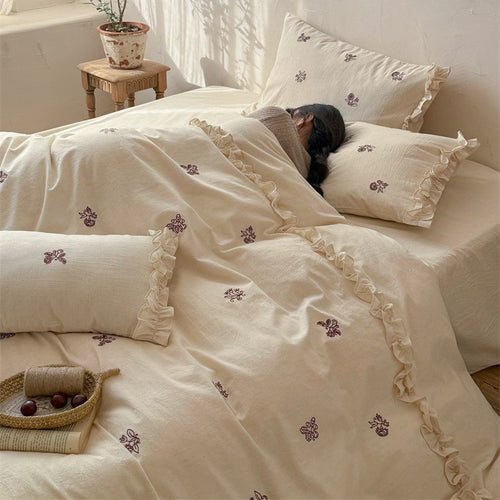 Cotton bedding set with embroidered floral motif and ruffled frills Bowlift
