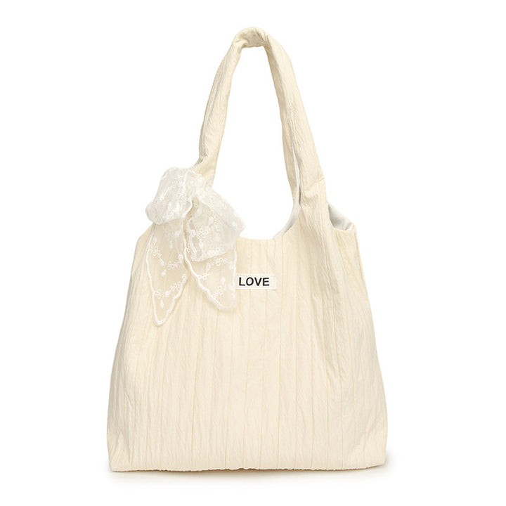 Leisure bag with structured design and playful scarf Bowlift