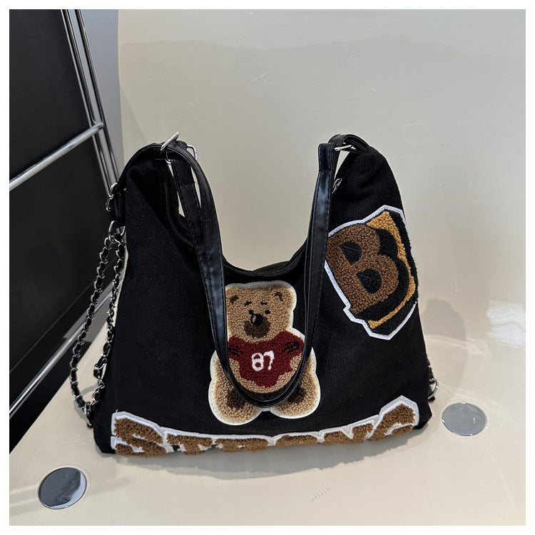 Shoulder bag in playful bear pattern Bowlift