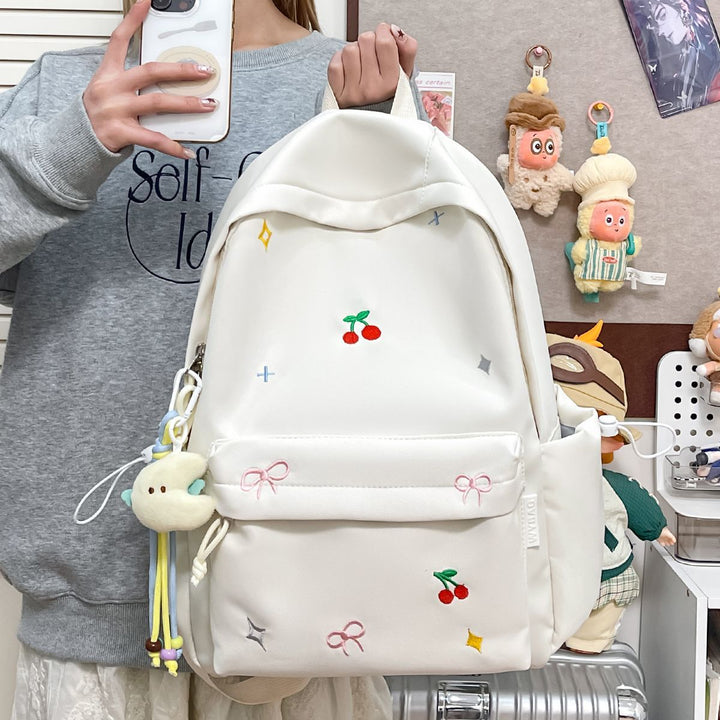 Playful backpack with embroidery Bowlift