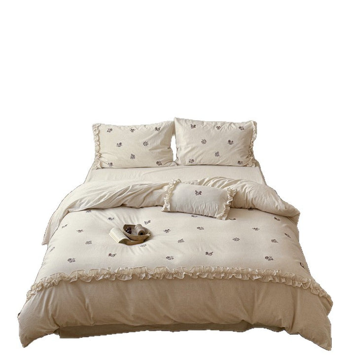 Cotton bedding set with embroidered floral motif and ruffled frills Bowlift