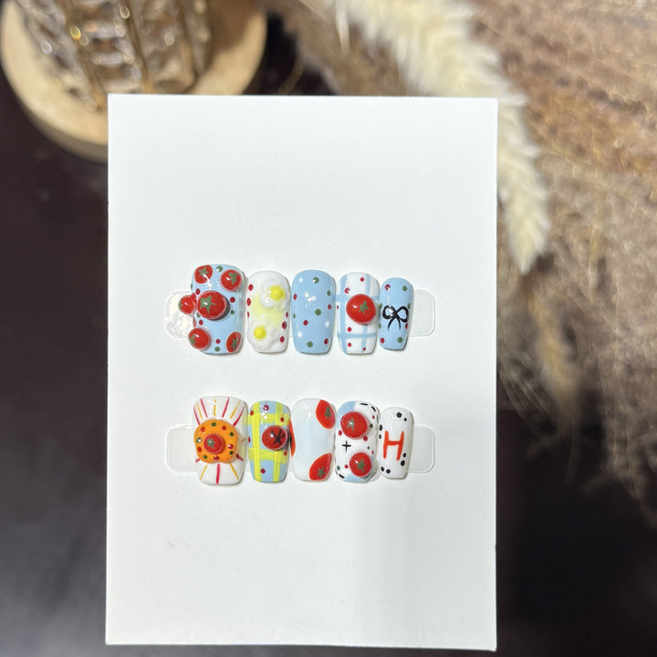 Artistic Press-On Nail Set with Playful Floral and Polka Dot Designs Bowlift