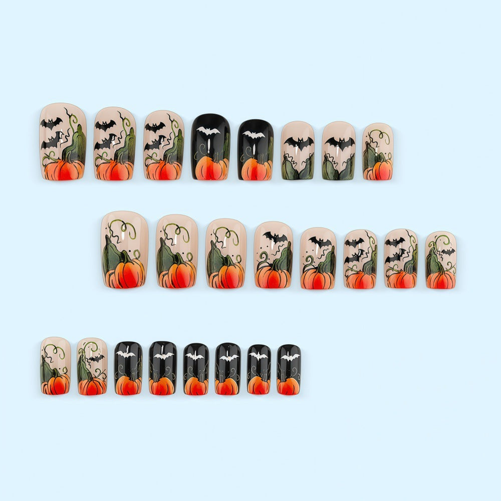 Artificial nails in Halloween design with pumpkins and ghosts Bowlift