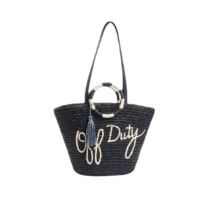 Designer shoulder bag with playful lettering and decorative tassel detail Bowlift