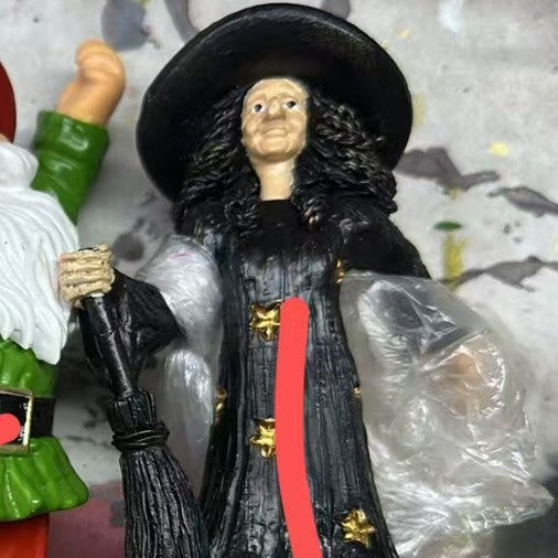 Decorative witch figure with broom Bowlift