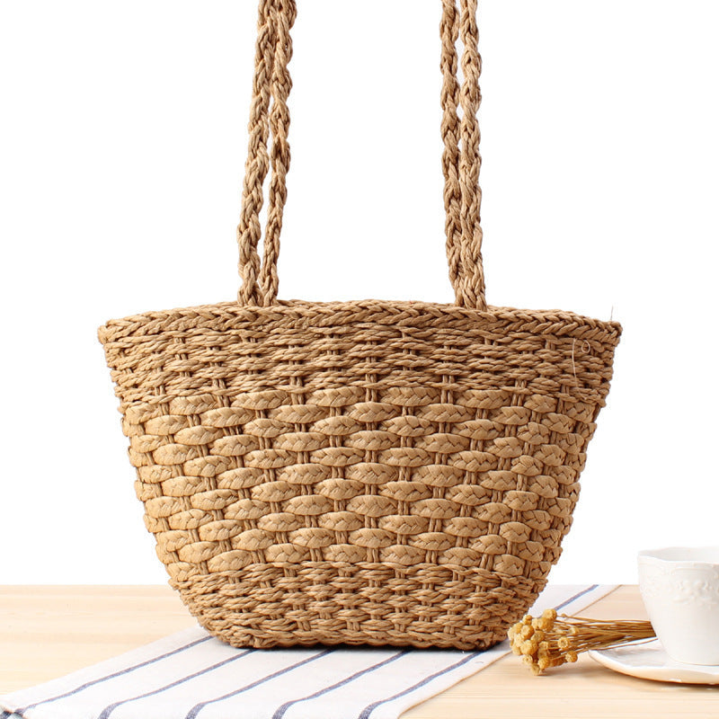 Braided handbag made of natural raffia with robust carrying straps Bowlift