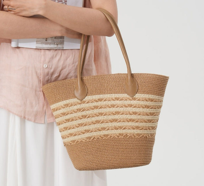 Beach bag made of natural woven material with elegant accents Bowlift
