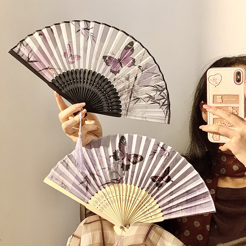Elegant fan with elaborate butterfly motif Bowlift
