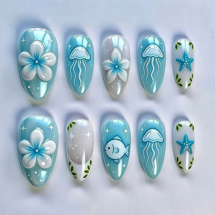 Artificial nails in a maritime design with colorful shell and water motifs Bowlift