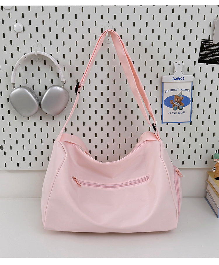 Sporty shoulder bag with spacious interior and sturdy carrying strap Bowlift