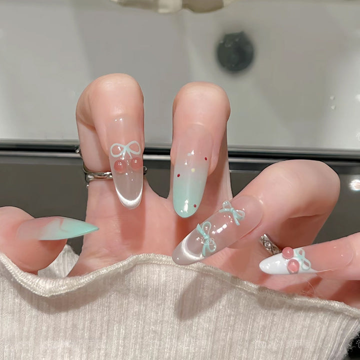 Artificial nail set with elegant bow and cherry designs Bowlift