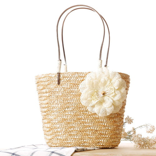 Elegant bast bag with flower appliqué Bowlift