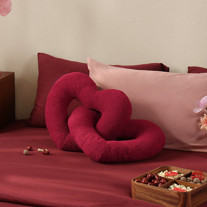 Braided heart cuddle pillow duo with bouclé cover and flexible filling