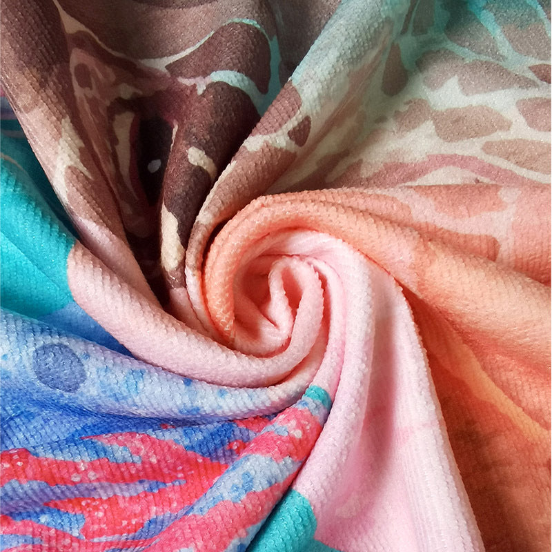 Beach towel with vibrant tropical plant motif Bowlift