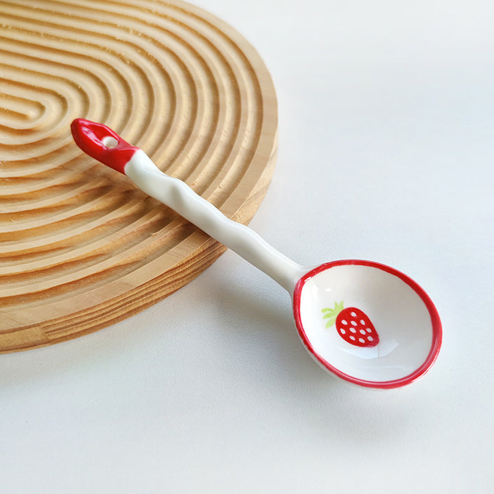 Ceramic soup spoon with lucky cat illustration and ergonomic long-handle Bowlift