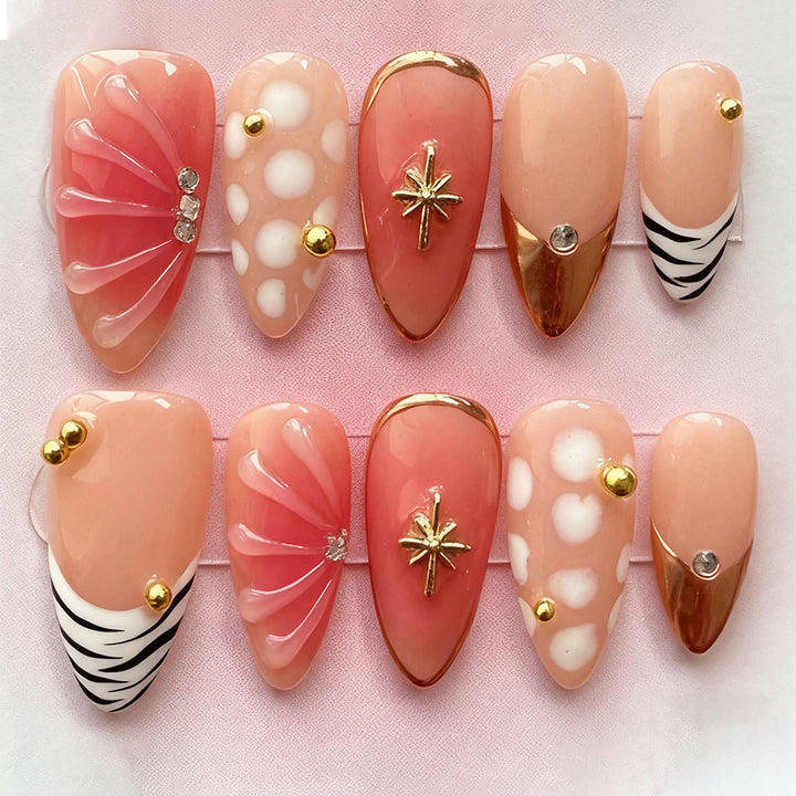 Acrylic nail set with elegant gold design and floral decor Bowlift