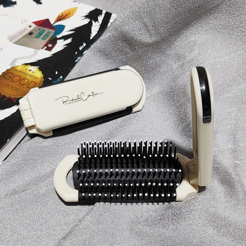 Compact hairbrush with integrated mirror | Bowlift