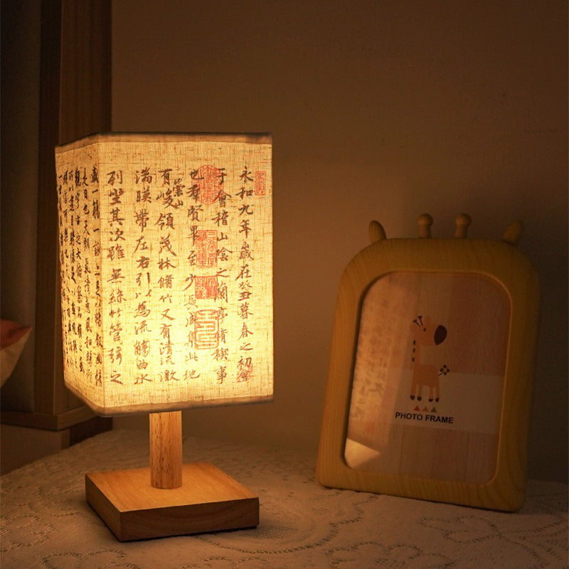 LED table lamp in a square design – wooden base with Japanese pattern | Bowlift
