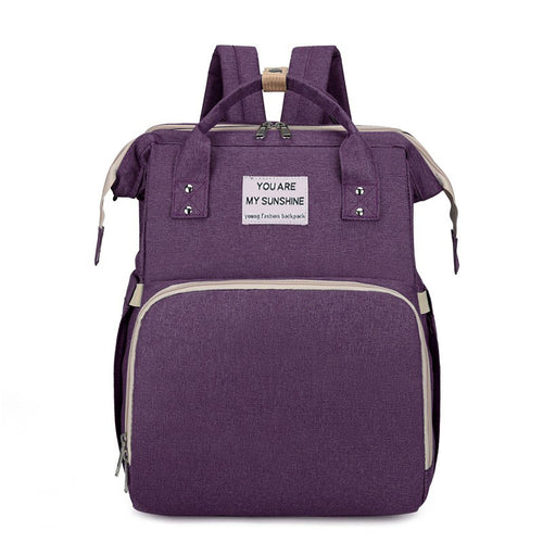 Diaper backpack with integrated changing bed