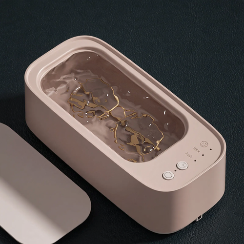 Ultrasonic cleaning device, portable, double chamber